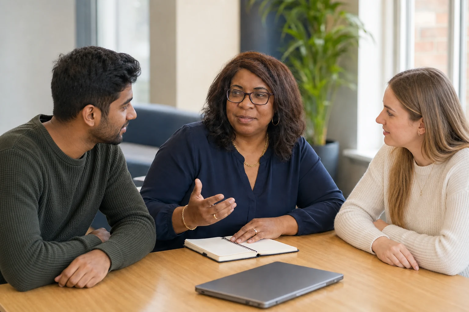 Sandy in a practical coaching conversation with two young adults